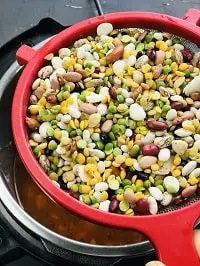 picked and rinsed beans in a colander