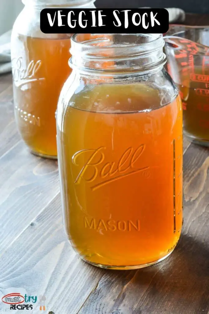 instant pot vegetable stock stored in a mason jar