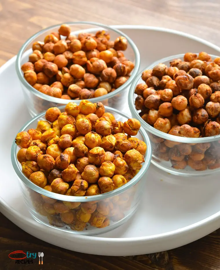 air fryer chickpeas no oil recipe served in 3 clear bowls kept on a white plate