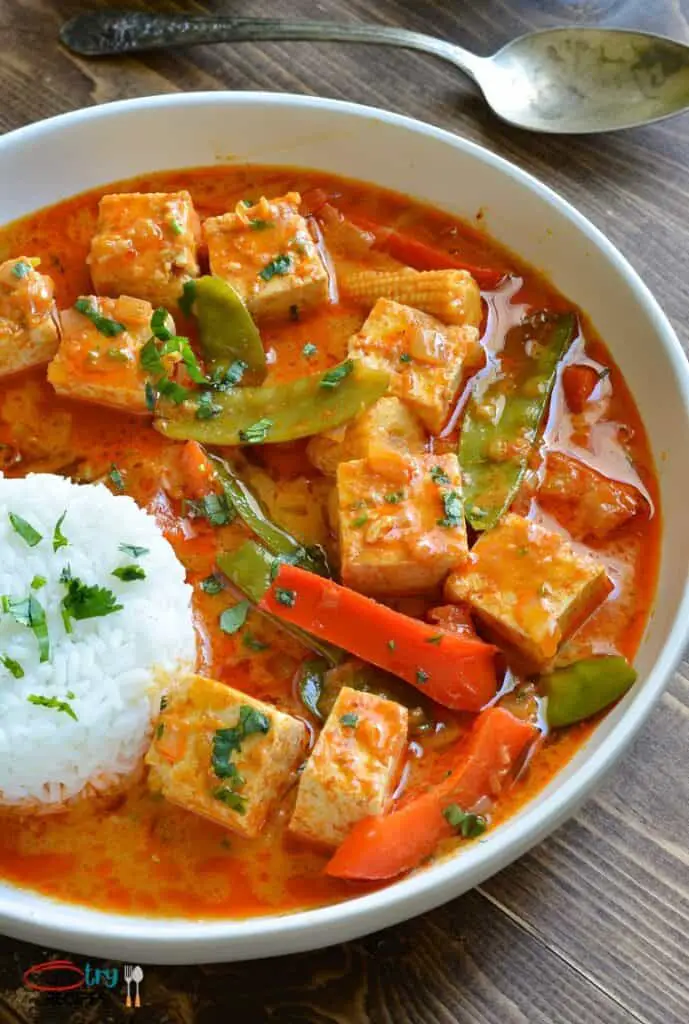 instant pot thai red curry tofu served with white rice on a white plate
