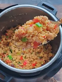 vegetable couscous in a ladle