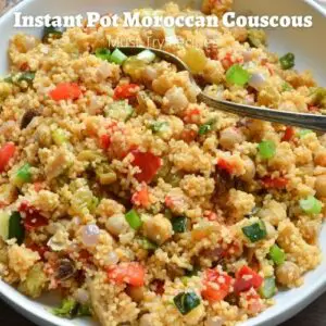 instant pot vegetable couscous served on a white plate with a spoon