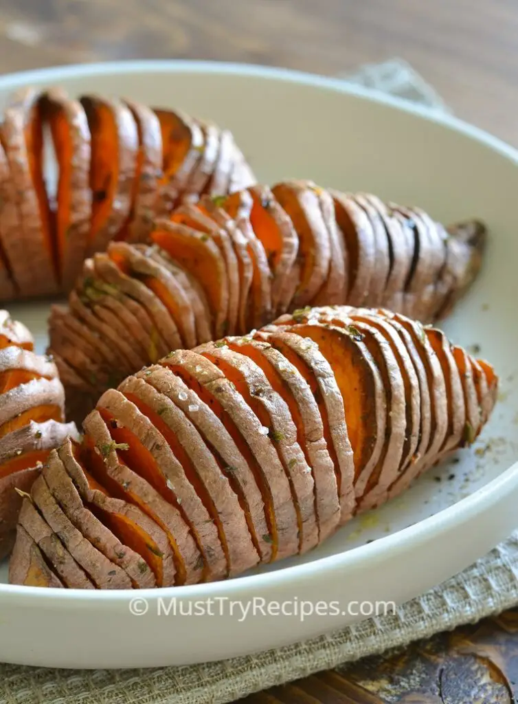 hasselback sweet potatoes in air fryer served on a white plate