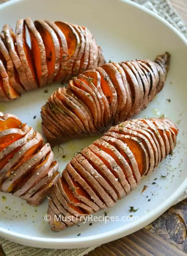hasselback sweet potatoes air fryer recipe on a white plate