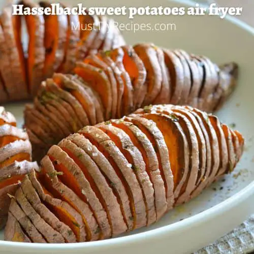 hasselback sweet potatoes on a white plate