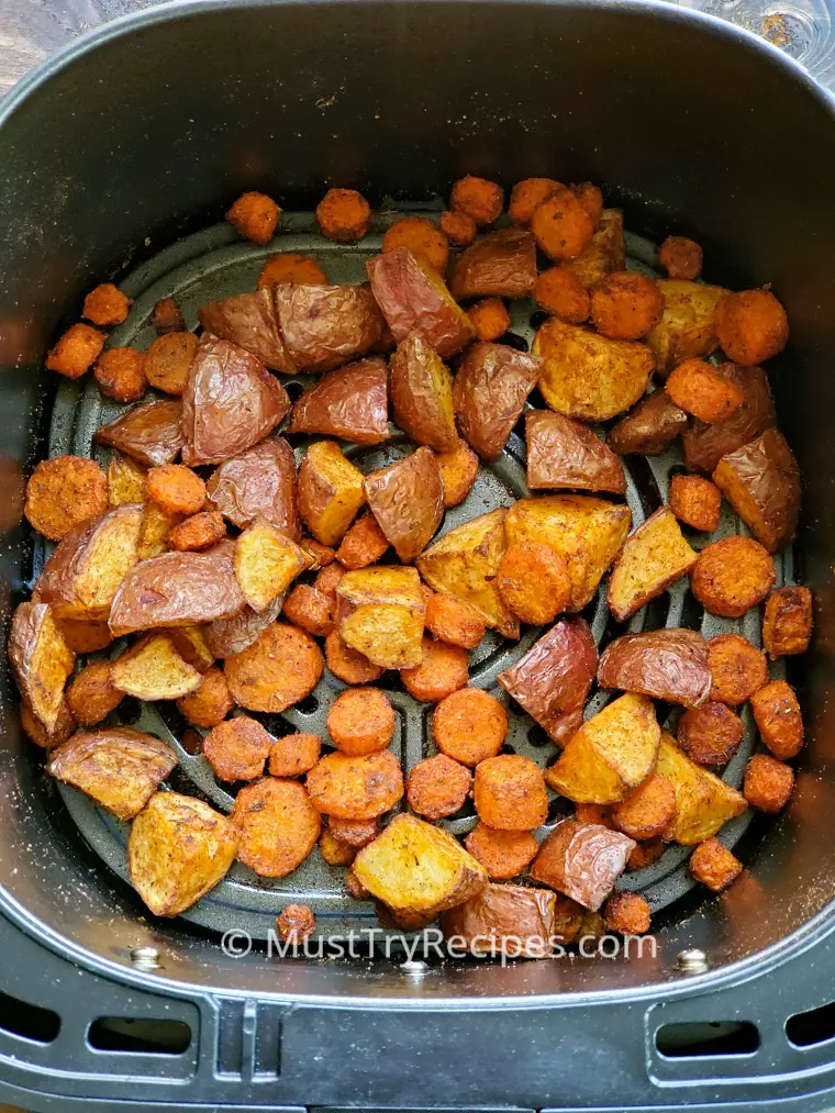 roasted carrots and potatoes in air fryer basket