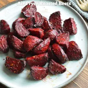 roasted red beets on a light grey plate
