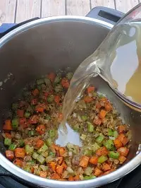 pouring veggie stock in instant pot