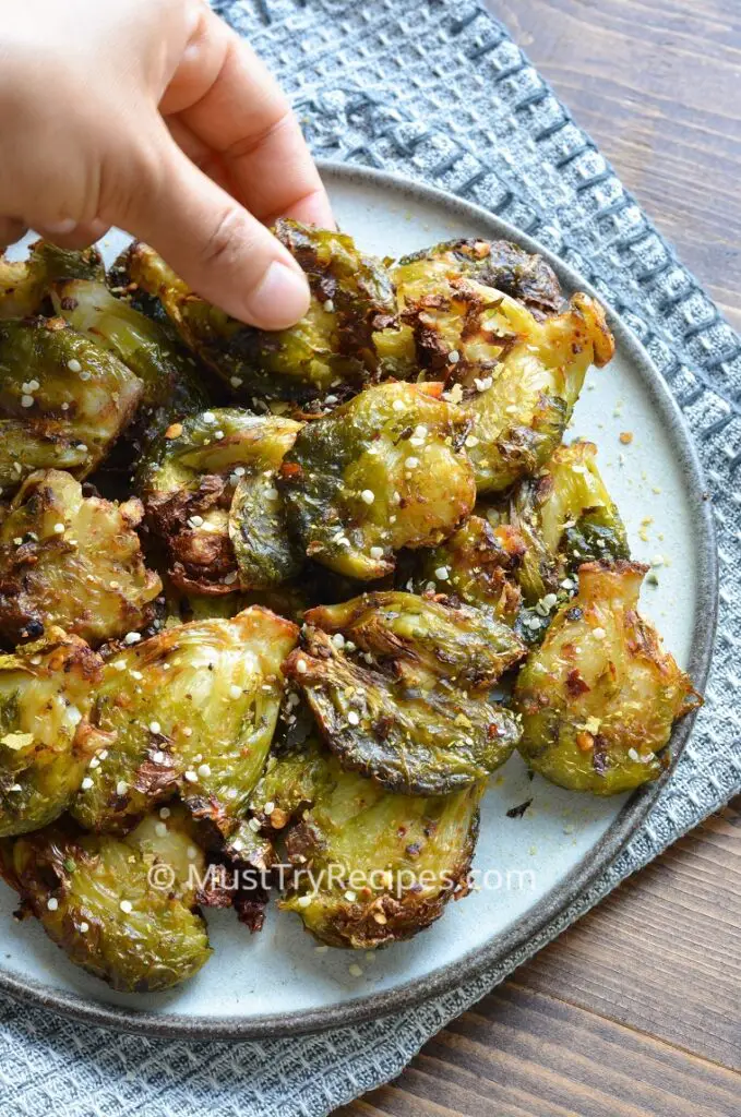 air fryer smashed brussel sprouts on a grey plate