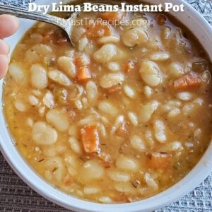 instant pot lima beans in a white bowl with a spoon