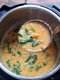 red lentil soup in a ladle