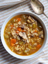 vegan mushroom barley soup in a white bowl