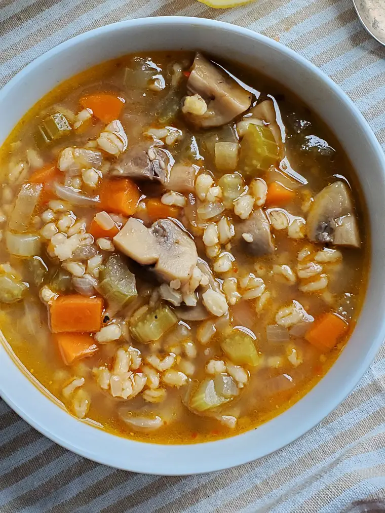 mushroom barley soup recipe in a white bowl