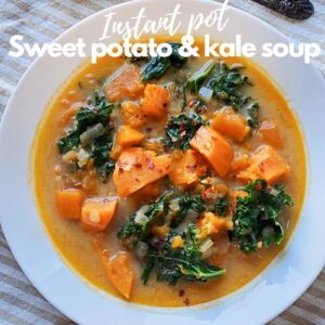 sweet potato and kale soup in a white plate