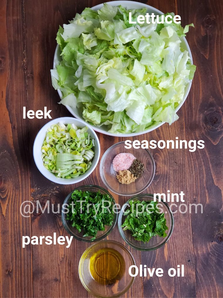 ingredients in various-sized bowls kept on top of a wooden board
