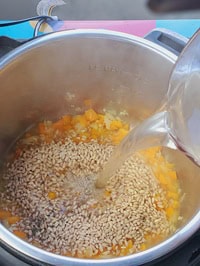 adding veggie stock