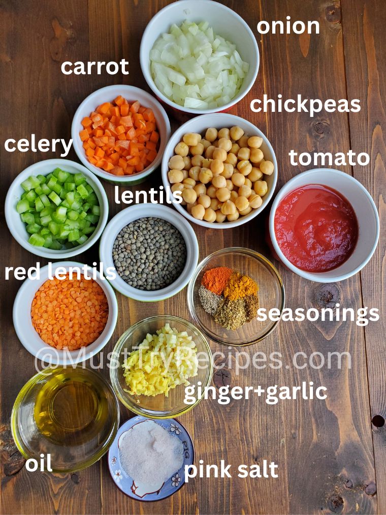 recipe ingredients in various-sized bowls kept on a wooden board.